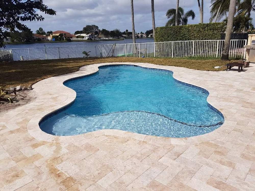 Freeform pool surrounded by lush landscaping