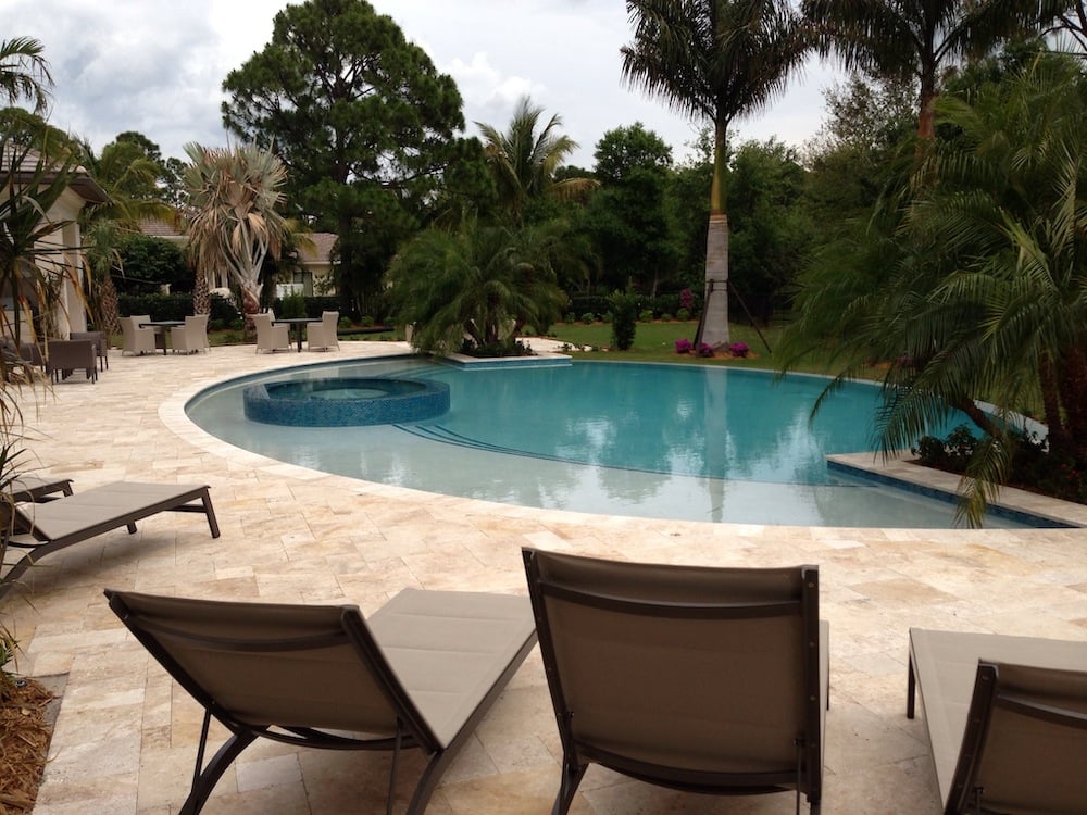Freeform backyard pool with spa