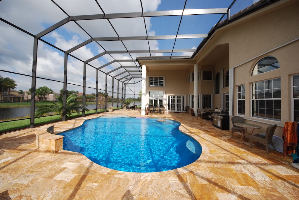 Freeform pool with vivid blue plaster finish