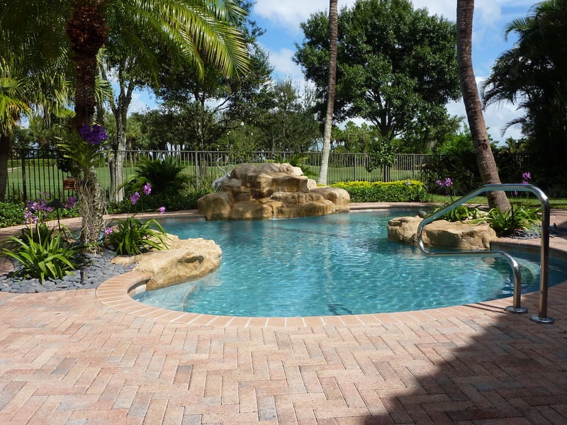 Rock waterfall feature on a Fountain Blue Pools pool