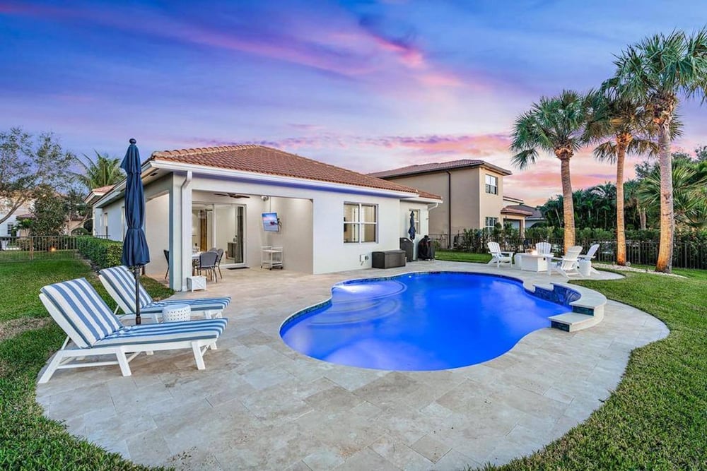 Freeform pool with tropical landscaping