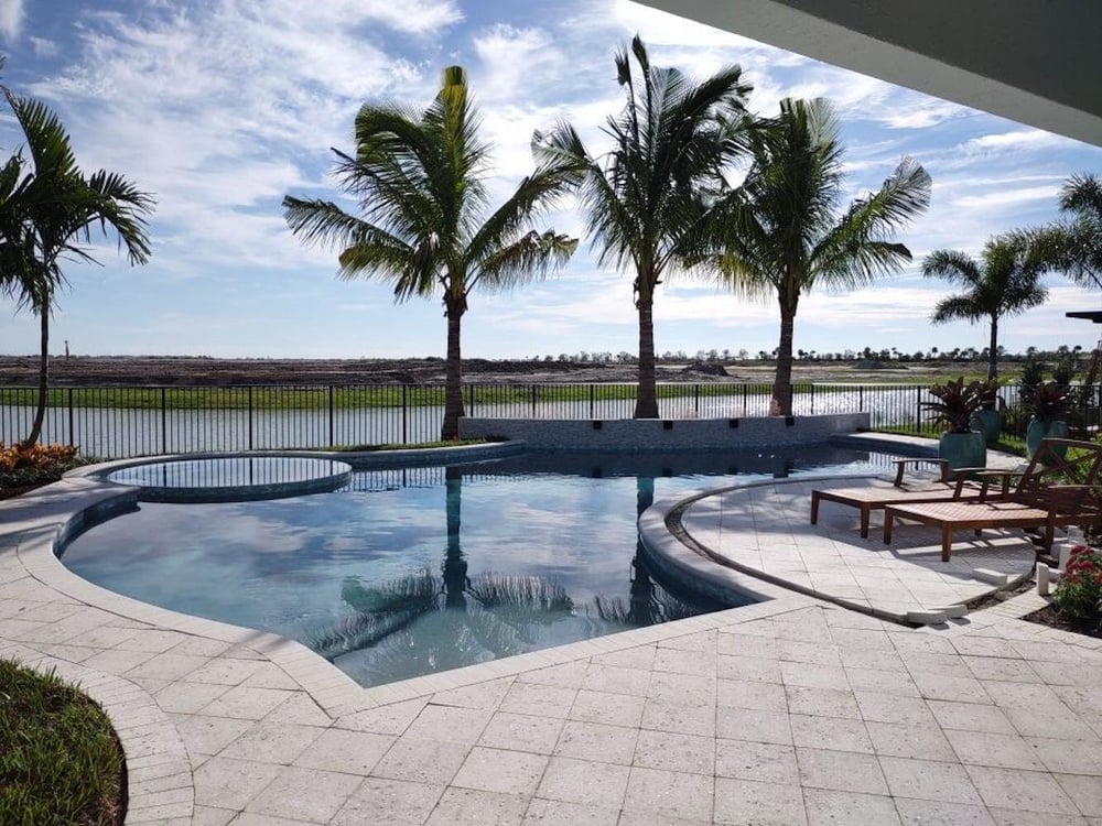 Backyard model pool with outdoor entertaining space